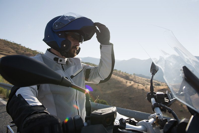 Guy wearing Shoei Neotec-2 flip-lid helmet on GS